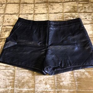 Black vegan leather quilted shorts